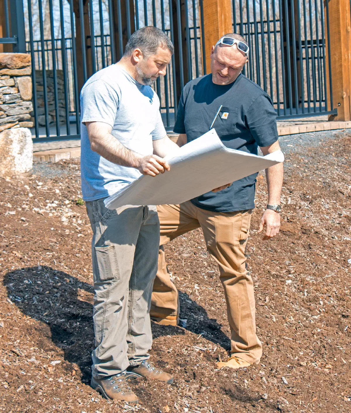 Mark Snow reviewing septic plans on a job site