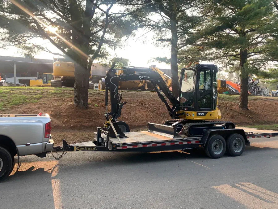 John Deere mini excavator loaded on a trailer
